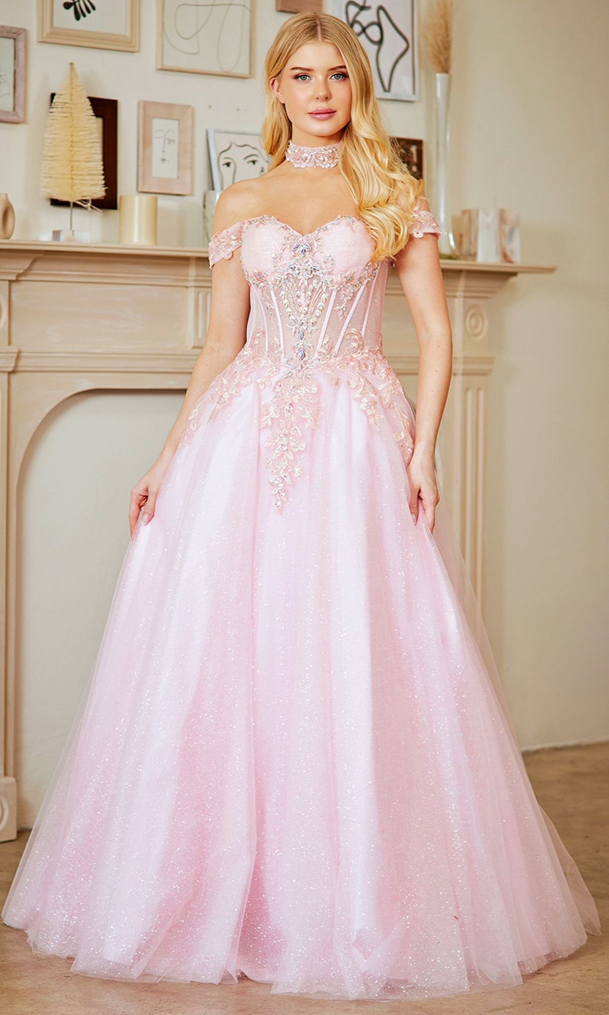 A woman in the Amelia Couture 8064 Long Prom Dress, a sparkling pink off-the-shoulder gown.